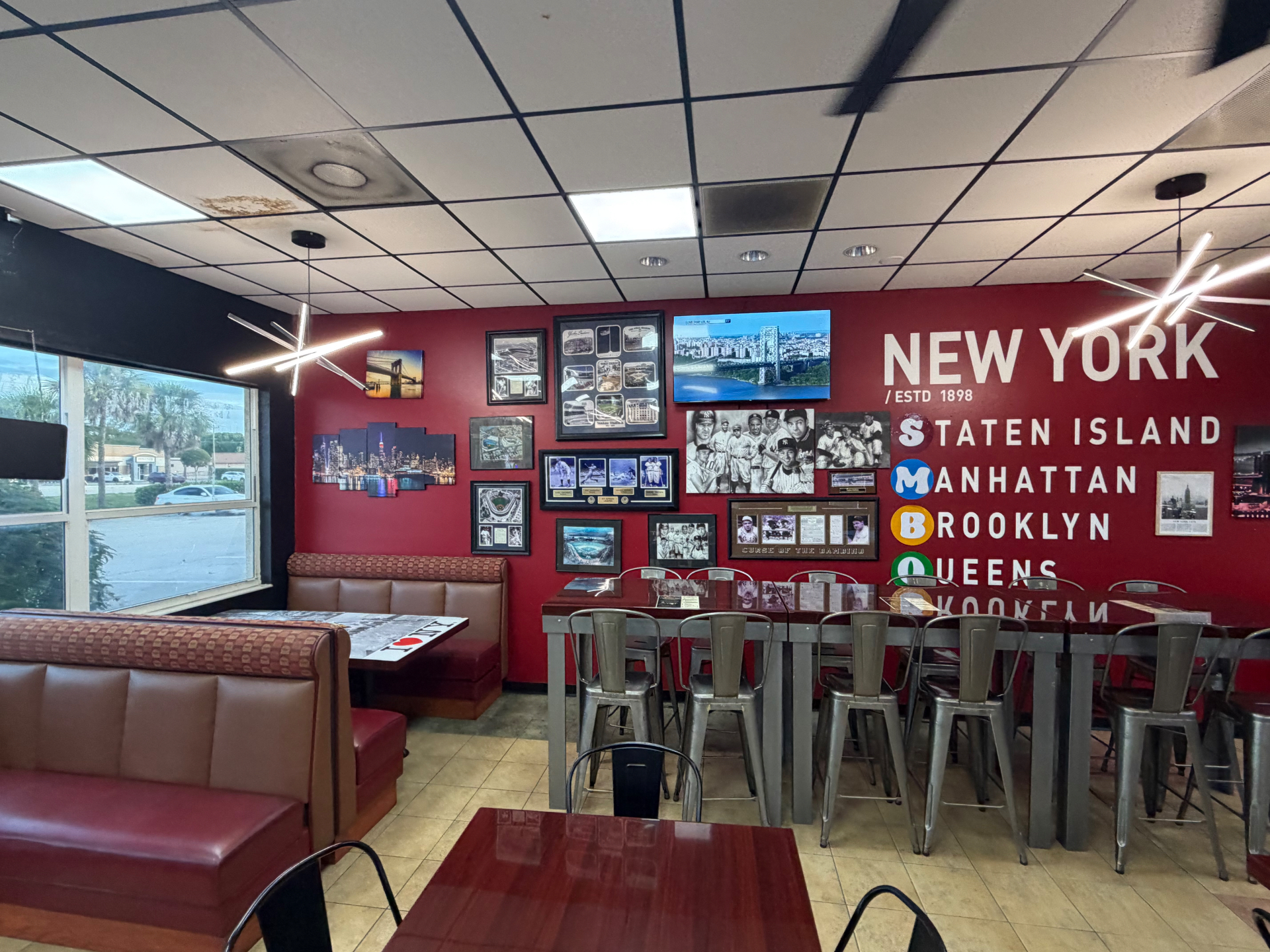 Breakfast Bros NY Cafe interior with red walls and New York decor